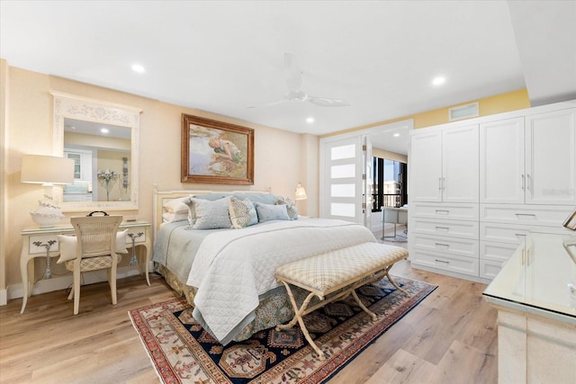 bedroom with light hardwood / wood-style flooring and ceiling fan