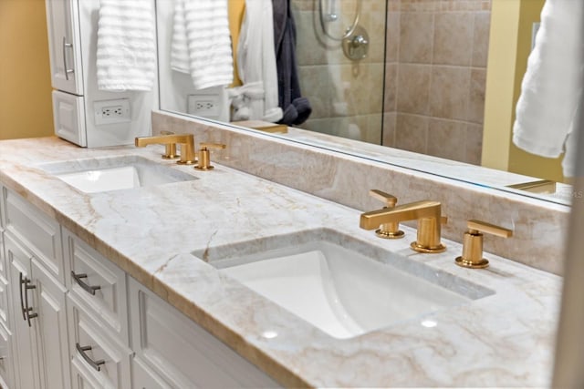 bathroom with vanity and walk in shower