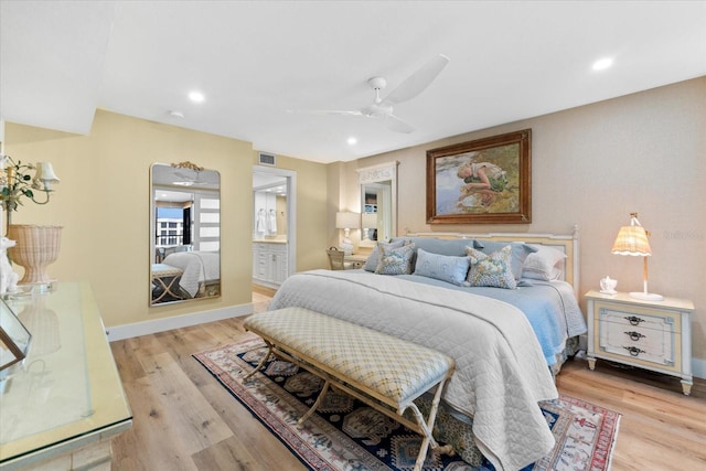 bedroom with ceiling fan, light hardwood / wood-style floors, and ensuite bath