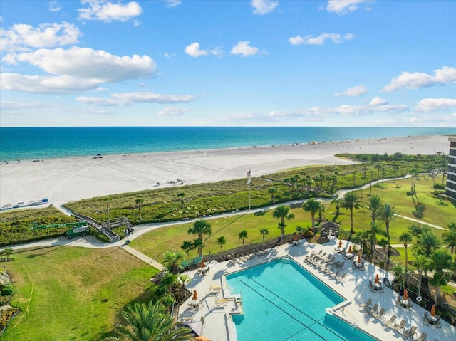 bird's eye view featuring a view of the beach and a water view