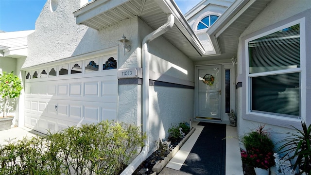 entrance to property featuring a garage