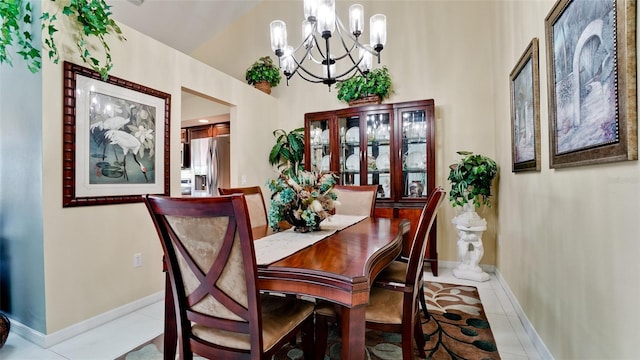 dining room with light tile patterned flooring and an inviting chandelier