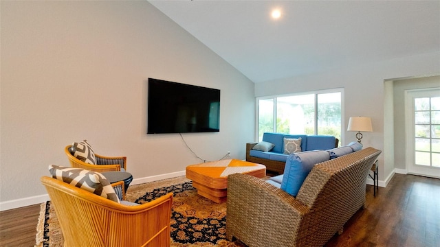 living room with dark hardwood / wood-style floors and vaulted ceiling