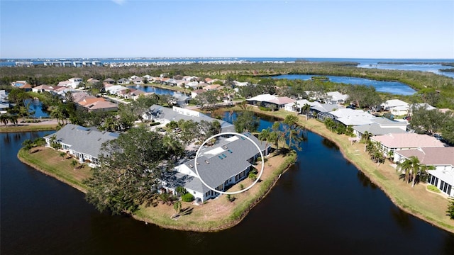 drone / aerial view with a water view