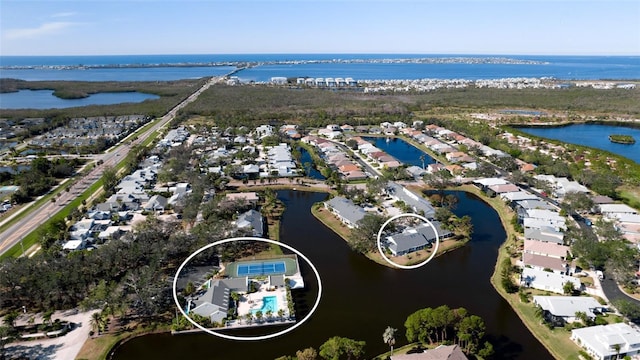 bird's eye view with a water view