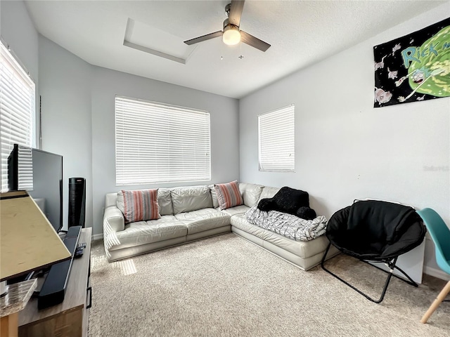 living room with carpet flooring and ceiling fan