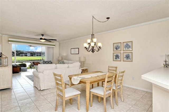 dining space with a textured ceiling, ceiling fan with notable chandelier, light tile patterned floors, and crown molding