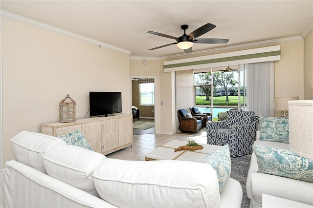 living room with ceiling fan, light tile patterned flooring, and ornamental molding