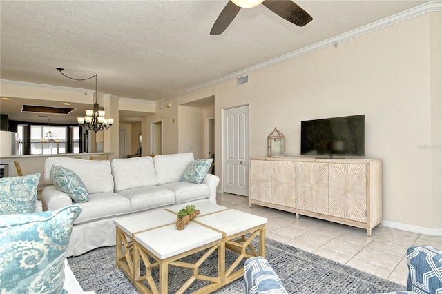 living room featuring light tile patterned floors, ceiling fan with notable chandelier, a textured ceiling, and ornamental molding