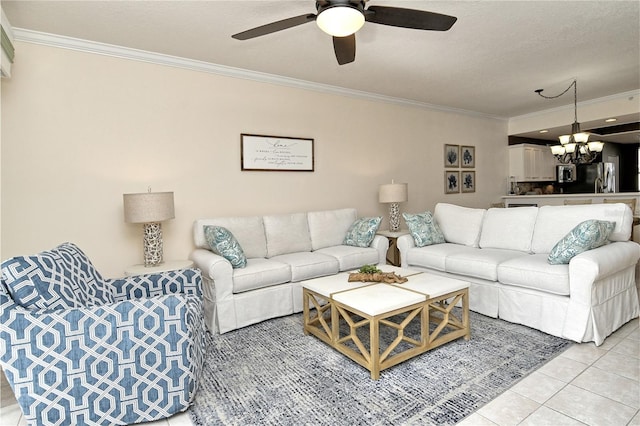 living room with ceiling fan with notable chandelier, ornamental molding, and light tile patterned floors