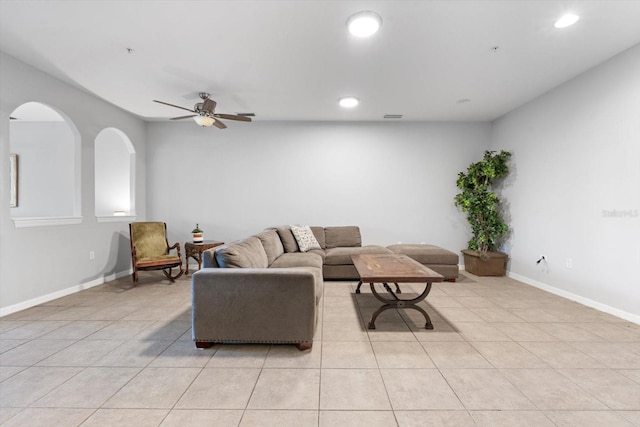 living room with ceiling fan and light tile patterned floors