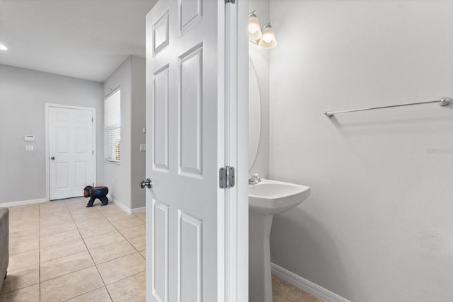 bathroom with tile patterned floors