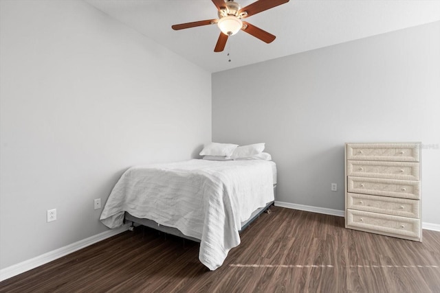 bedroom with ceiling fan, dark hardwood / wood-style flooring, and lofted ceiling