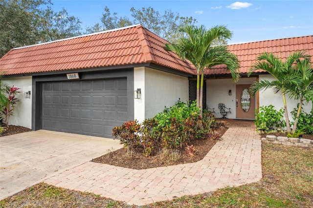 ranch-style house featuring a garage