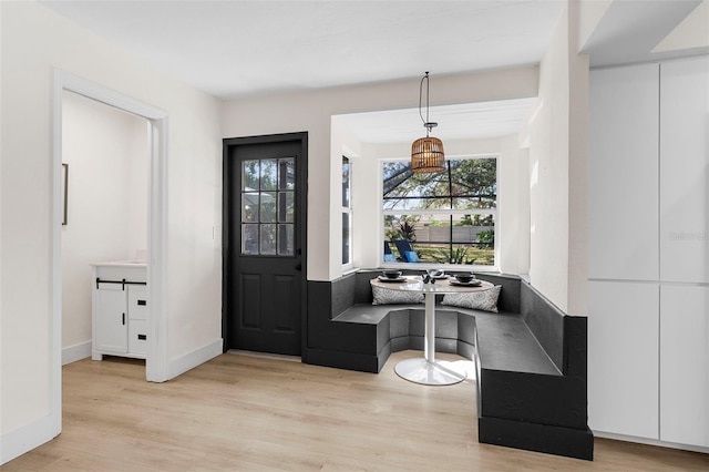 entrance foyer featuring breakfast area and light hardwood / wood-style floors