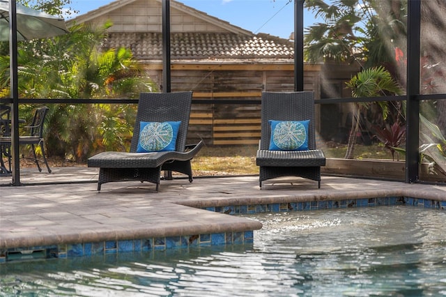 view of swimming pool with a patio