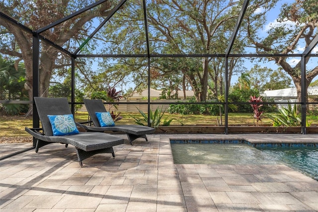 view of patio featuring glass enclosure