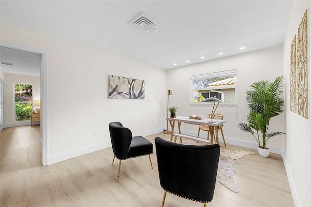 office with light hardwood / wood-style floors