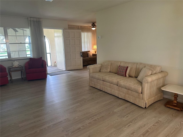 430 Botticelli Dr Unit 430, Nokomis, FL 34275 - living room featuring wood finished floors and a ceiling fan