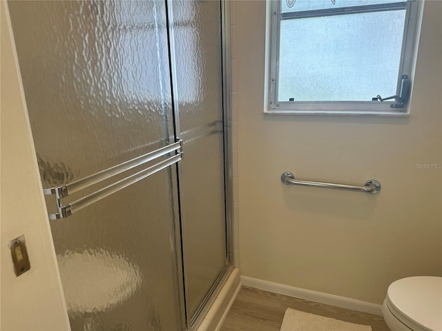 430 Botticelli Dr Unit 430, Nokomis, FL 34275 - full bathroom featuring an enclosed shower and wood finished floors