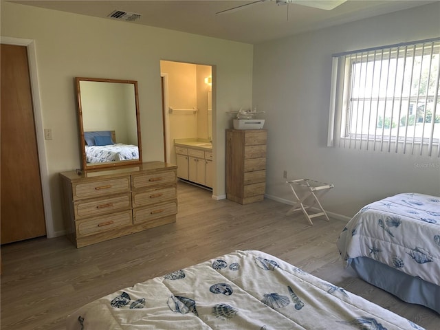 430 Botticelli Dr Unit 430, Nokomis, FL 34275 - bedroom featuring light wood-type flooring and ensuite bathroom