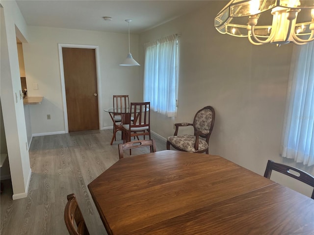 430 Botticelli Dr Unit 430, Nokomis, FL 34275 - dining room featuring a chandelier and wood finished floors