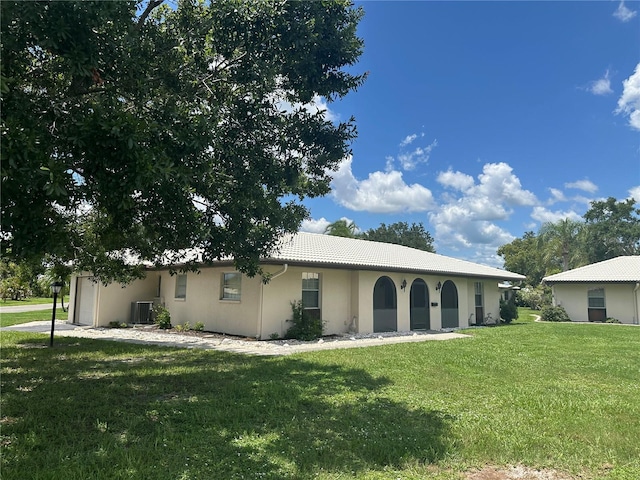 430 Botticelli Dr Unit 430, Nokomis, FL 34275 - view of front of house featuring a front yard, stucco siding, a tiled roof, and an attached garage