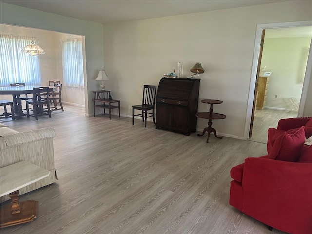 430 Botticelli Dr Unit 430, Nokomis, FL 34275 - living room featuring wood finished floors and a chandelier