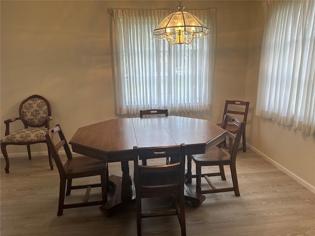430 Botticelli Dr Unit 430, Nokomis, FL 34275 - dining room featuring a chandelier, healthy amount of natural light, and light wood-type flooring