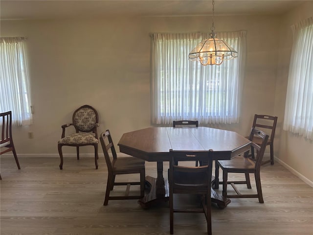 430 Botticelli Dr Unit 430, Nokomis, FL 34275 - dining area with a chandelier and light wood-style flooring
