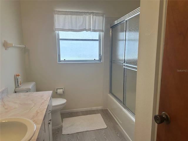 430 Botticelli Dr Unit 430, Nokomis, FL 34275 - full bathroom featuring vanity, shower / bath combination with glass door, and wood finished floors