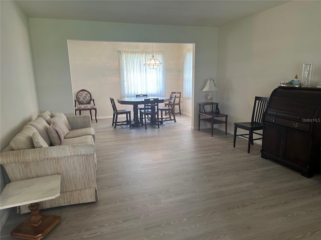 430 Botticelli Dr Unit 430, Nokomis, FL 34275 - living area featuring wood finished floors and a chandelier