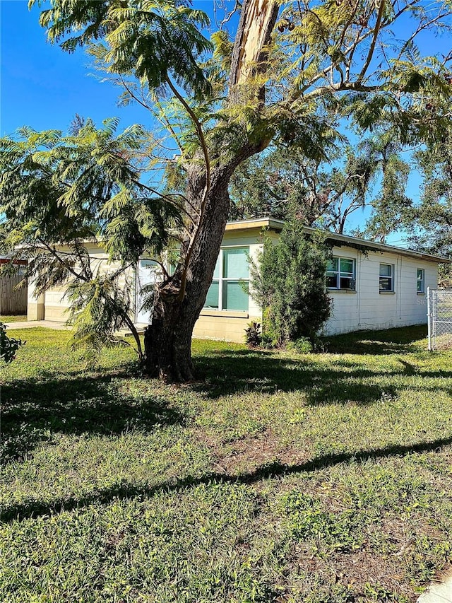 view of home's exterior featuring a lawn