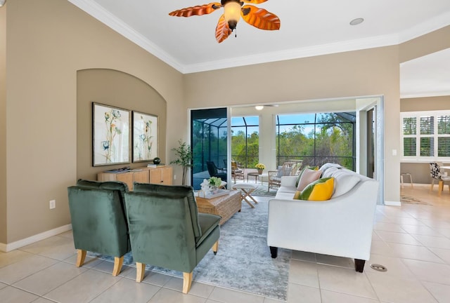 living room featuring ceiling fan, crown molding, and light tile patterned floors