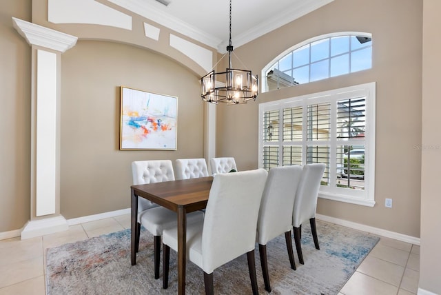 dining area featuring an inviting chandelier, light tile patterned floors, and ornamental molding