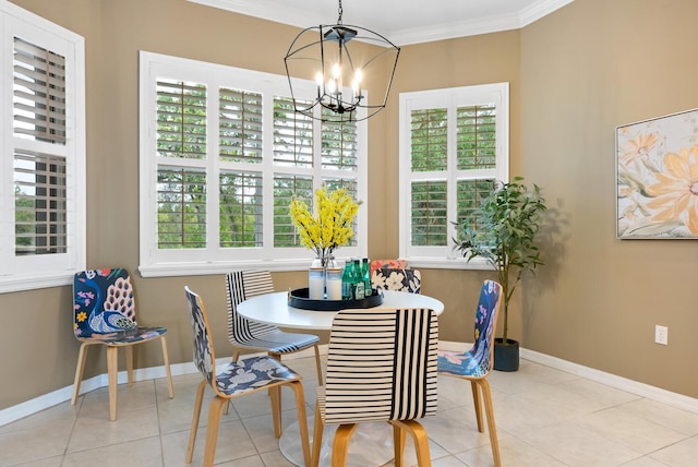 dining space with plenty of natural light, light tile patterned floors, ornamental molding, and an inviting chandelier