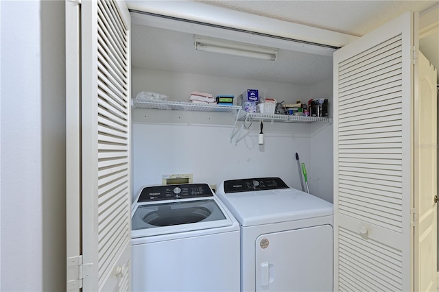 laundry area with washer and clothes dryer