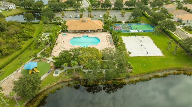 birds eye view of property with a water view