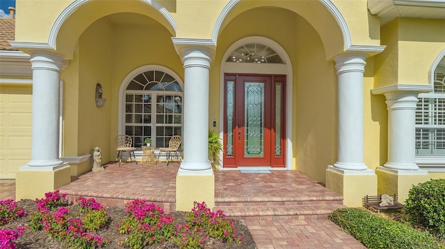 entrance to property featuring a porch