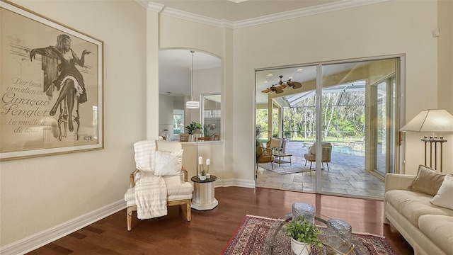 sitting room featuring hardwood / wood-style flooring and ornamental molding