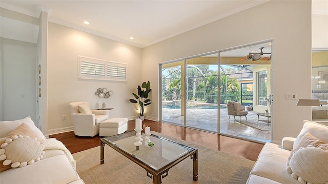 living room featuring hardwood / wood-style floors and crown molding