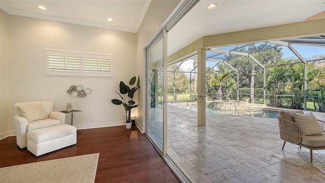 entryway with hardwood / wood-style flooring and ornamental molding