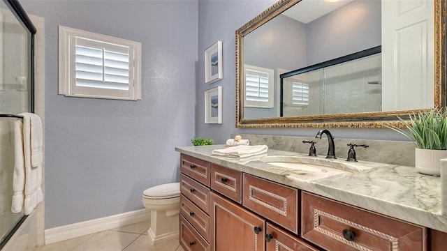 bathroom with tile patterned floors, a wealth of natural light, vanity, and walk in shower