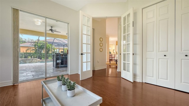 entryway with ceiling fan, french doors, and dark hardwood / wood-style floors