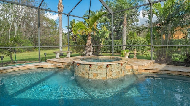 view of pool with a lanai and an in ground hot tub