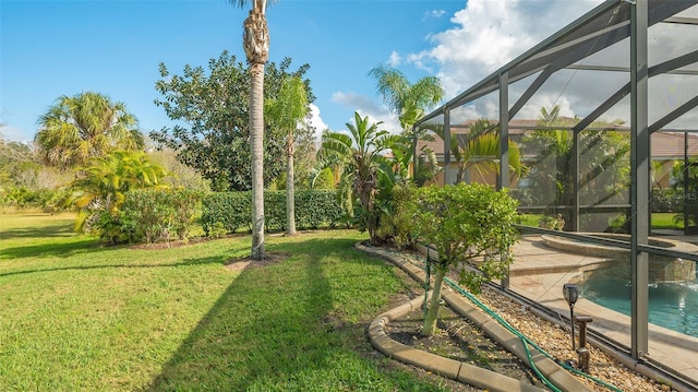 view of yard with glass enclosure