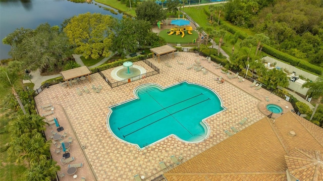 view of swimming pool featuring a water view