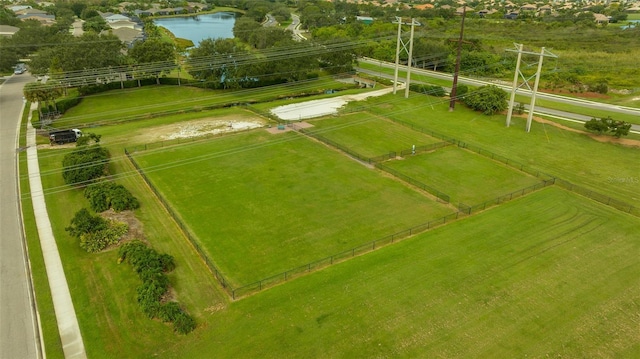 birds eye view of property with a water view and a rural view