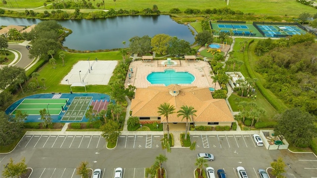 birds eye view of property with a water view