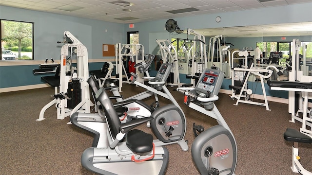 gym featuring a paneled ceiling